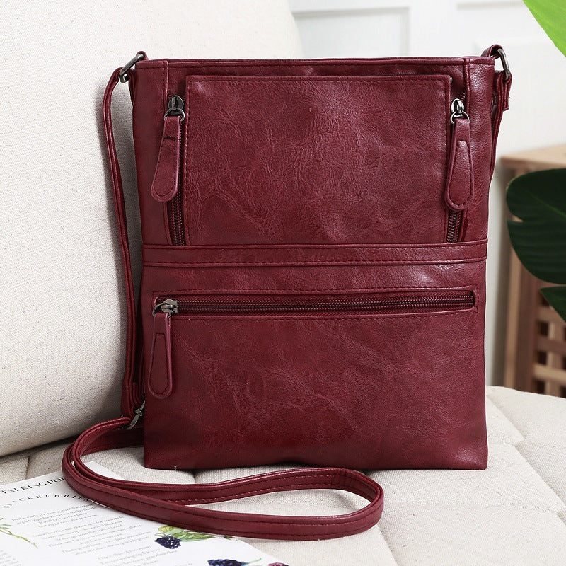 Front zipper contrast messenger bag