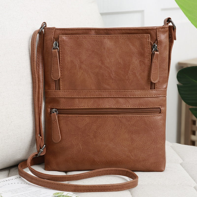 Front zipper contrast messenger bag