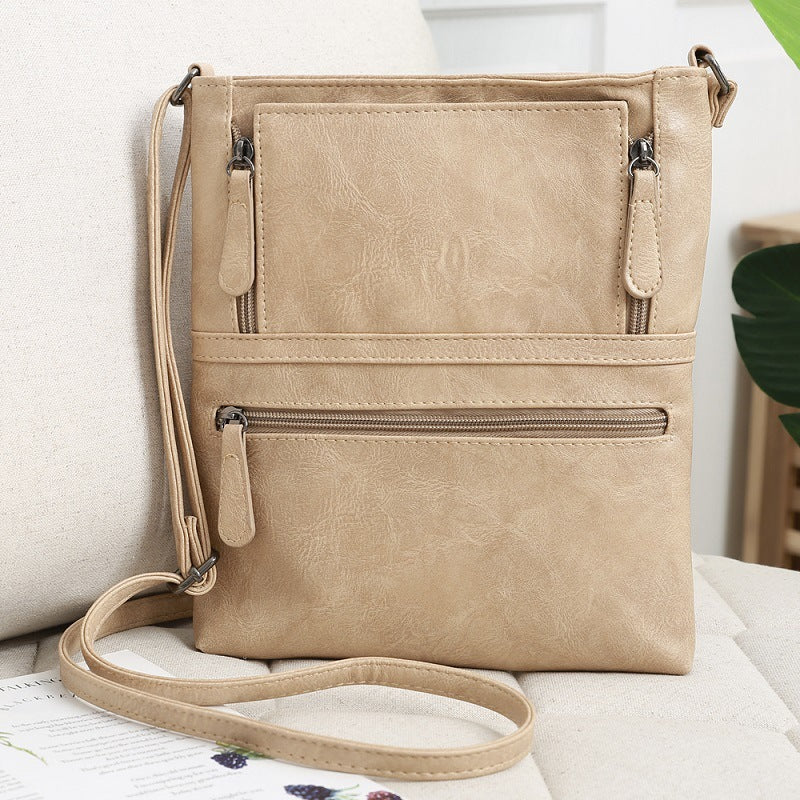 Front zipper contrast messenger bag