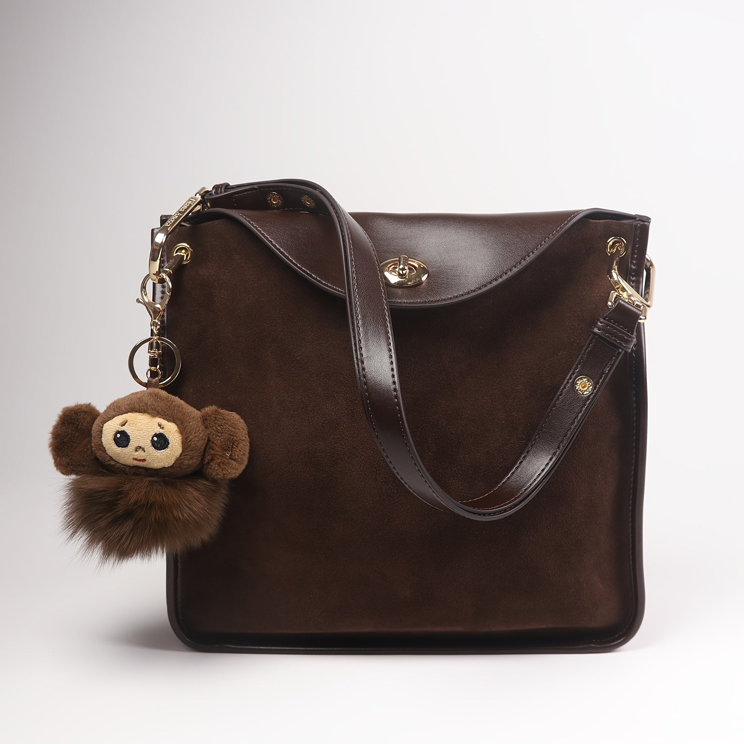 Elegant Top Grain Leather Crossbody Bag with Cartoon Monkey Charm, Lightweight Solid Coffee Shoulder Purse with Adjustable Strap, Buckle Closure and Cotton Lining, Asian Collection - Guangzhou Crafted